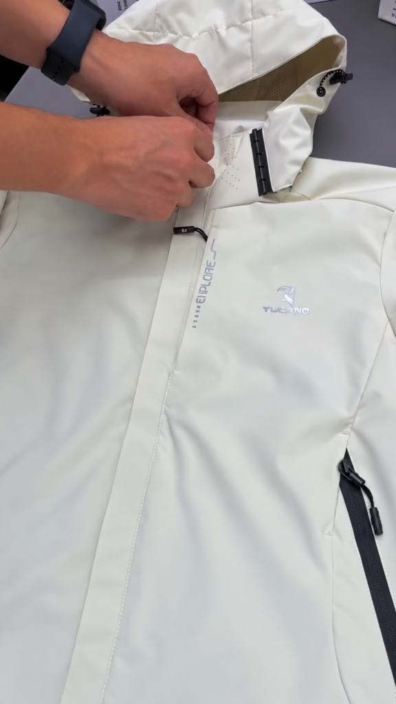 A white hooded tailored jacket with a mesh lining