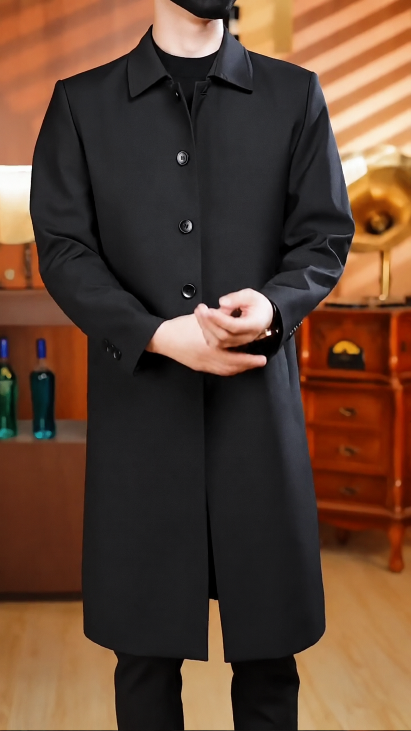 A slim-fit long trench coat with a notched collar