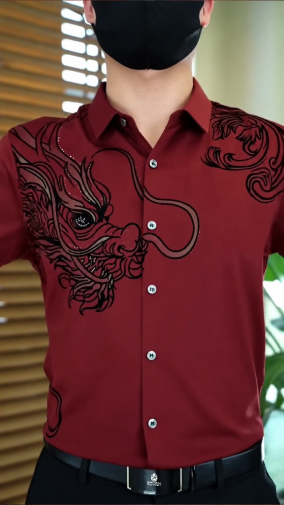 A black designer shirt with dragon-motif handwork and bead embroidery