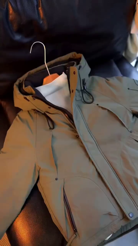 A fawn and olive winter parka with a fur-trimmed hood