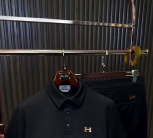 A solid black polo-neck T-shirt