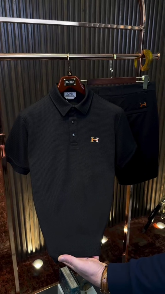 A solid black polo-neck T-shirt