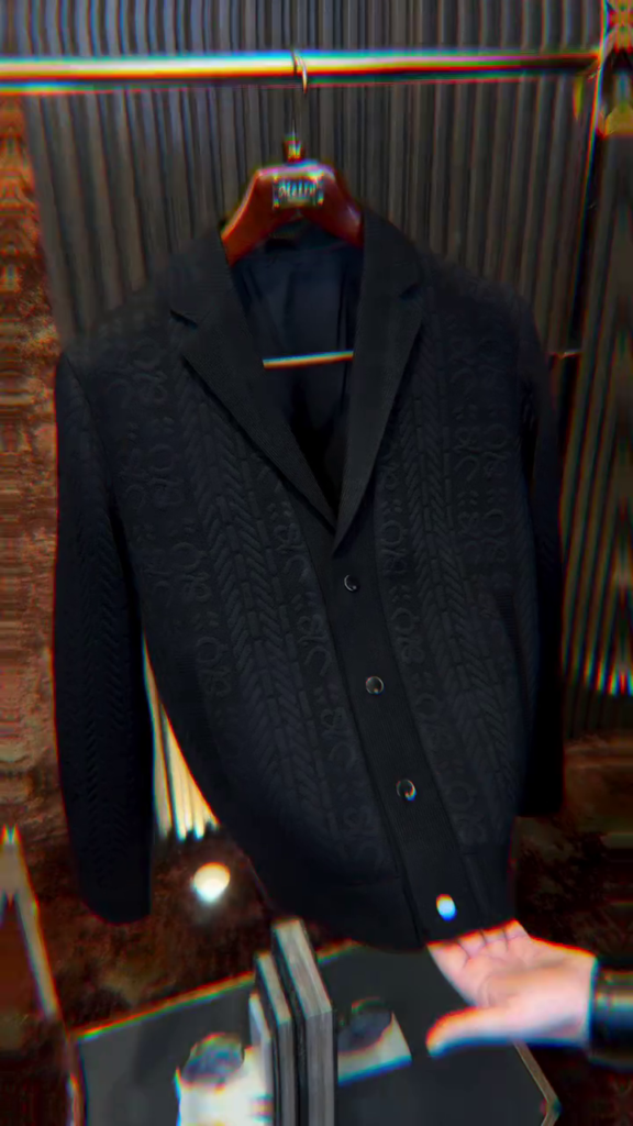 A black single-breasted casual blazer with a textured weave