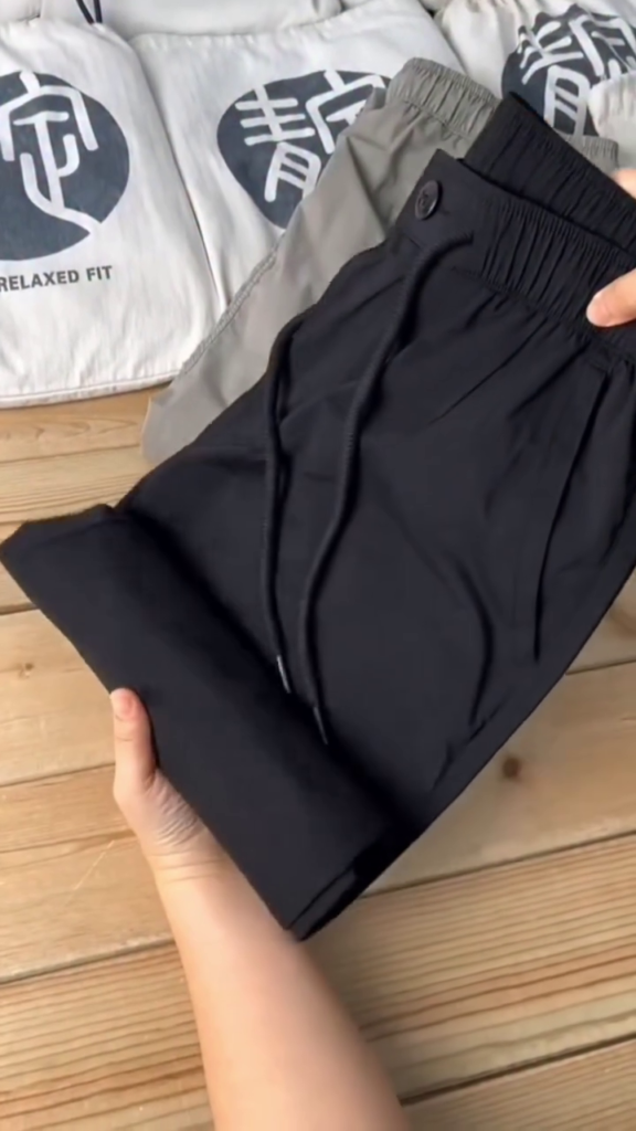 Black smart-casual stretch trousers with an elastic waist