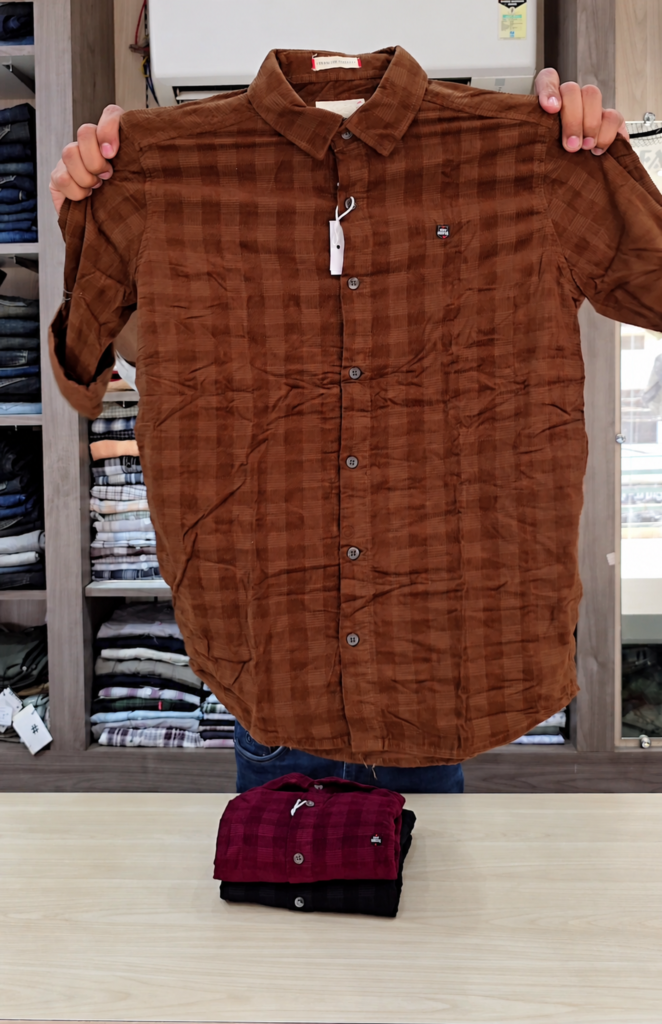 A brown tartan-check cotton shirt with a patch pocket