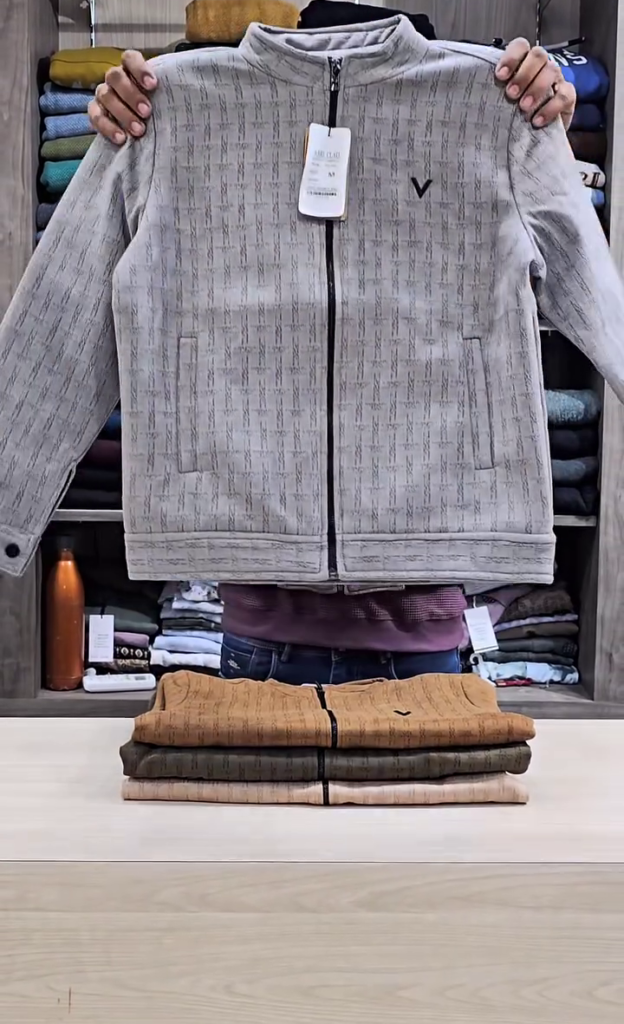 A grey micro-check tailored jacket with a mock collar