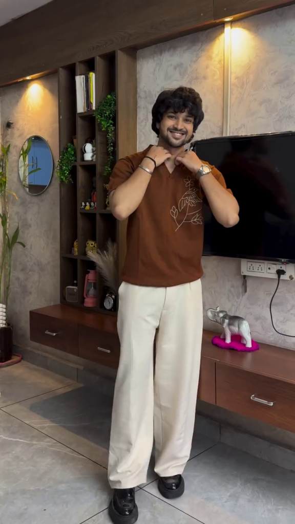 A brown self-design polo with drop-shoulder sleeves